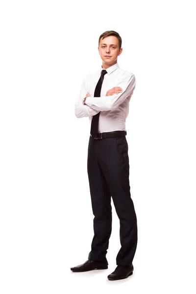 Joven hombre de negocios guapo está de pie cruzado de manos. retrato aislado sobre fondo blanco — Foto de Stock