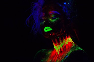 Beautiful extraterrestrial model woman with blue hair and green lips in neon light. It is portrait of beautiful model with fluorescent make-up, Art design of female posing in UV with colorful make up clipart