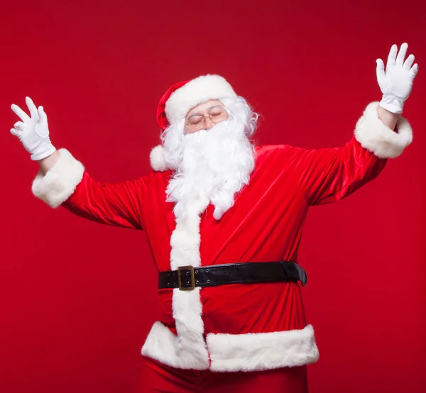 Santa Claus is dancing Isolated on red background. — Stock Photo, Image
