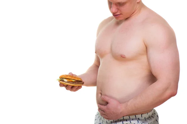 Uomo grasso con hamburger isolato pasto spazzatura porta all'obesità. Interruzione del concetto di dieta. Sta cercando di andare a dieta. . — Foto Stock