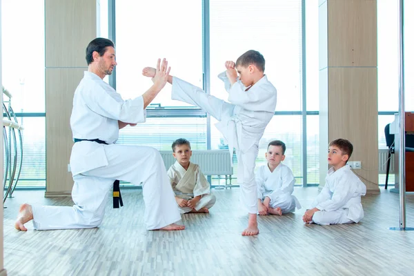 Young, beautiful, successful multi ethical kids in karate position — Stock Photo, Image