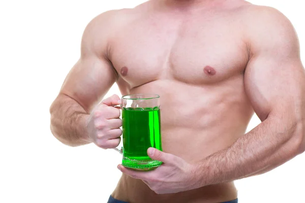 St. Patricks day. A muscular man in a green hat holds a mug of ale and beer. Isolated white background. ABS. — 스톡 사진