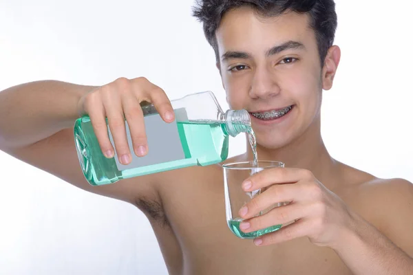 Teen boy wearing braces on white background — Stock Photo, Image