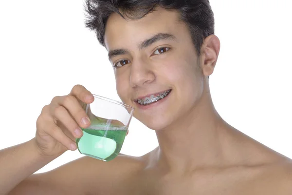 Teen boy wearing braces on white background — Stock Photo, Image