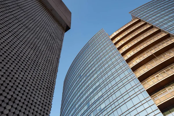 Milan, Italy, March 2020. Modern building with lots of blue windows. Milan 01.20 — Stock Photo, Image