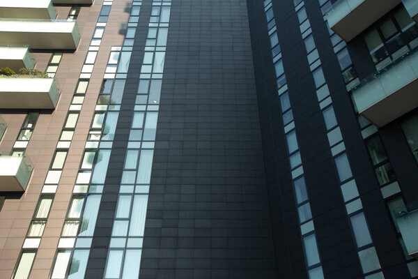 Black beautiful fashionable modern tile on a high-rise building. 01.2020 Milan.