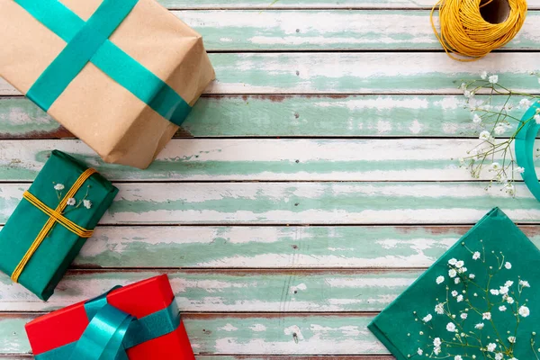 Gifts on a rustic table with an empty copyspace — Stock Photo, Image