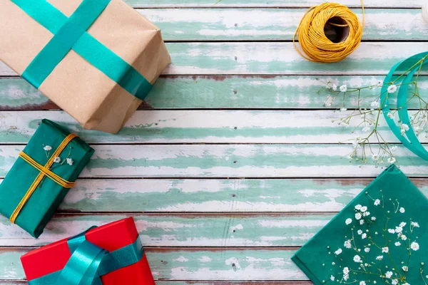 Gifts on a rustic table with an empty copyspace — Stock Photo, Image