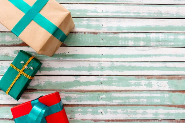 Gifts on a rustic table with an empty copyspace — Stock Photo, Image