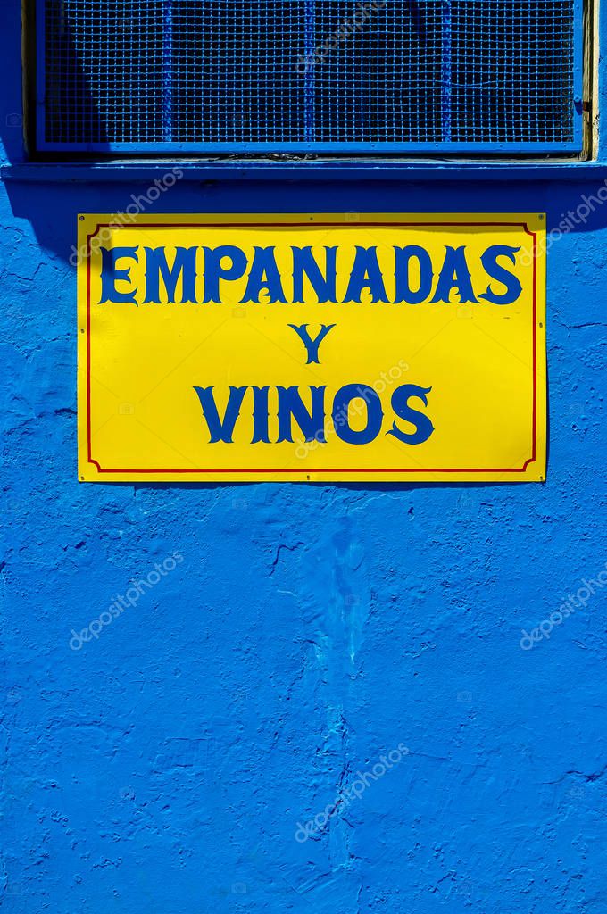 Yellow and blue wall with a sign of 