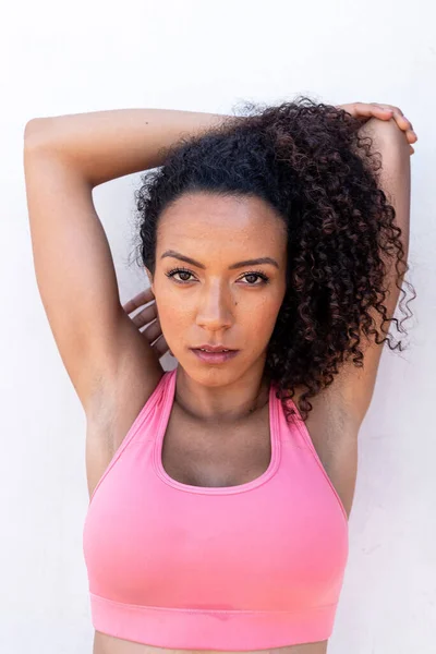 Portrait Latin American Woman Jogger Pink Top Stretching Outdoors White — Stock Photo, Image