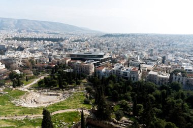 February 2, 2018: Views of Athens with the new Acropolis Museum and Theatre of Dionysus Eleuthereus in the foreground. Athens, Greece