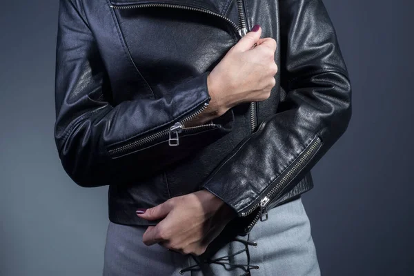 close-up of black leather jacket details front view of a jacket made of high quality leather, details. Fasten the sleeves, arms together,