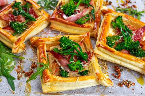 Bacon, cheese, tenderstem broccoli tips puff pastry, with green salad.