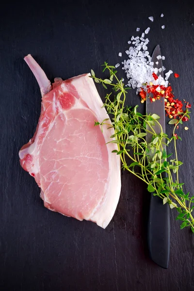 Top view Raw pork cutlet close up. on stone background — Stock Photo, Image