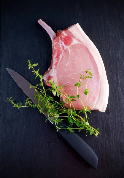 Top view Raw pork cutlet close up. on stone background — Stock Photo, Image