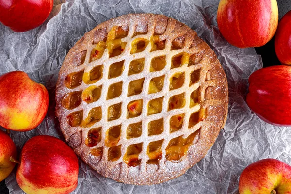 Home baked Lattice apple pie on black background
