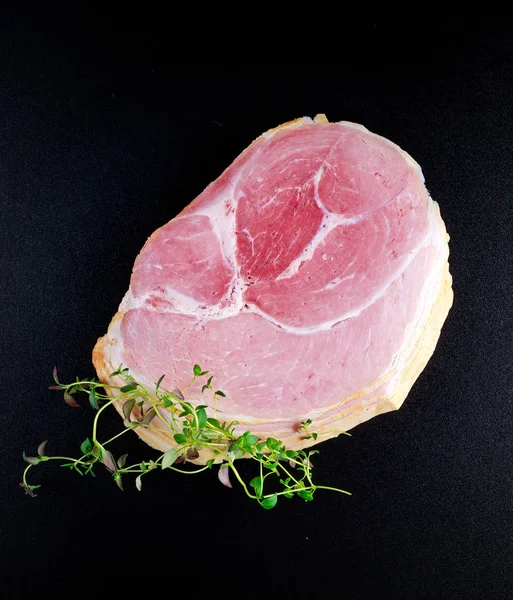 Wiltshire ham slices on black board background — Stock Photo, Image