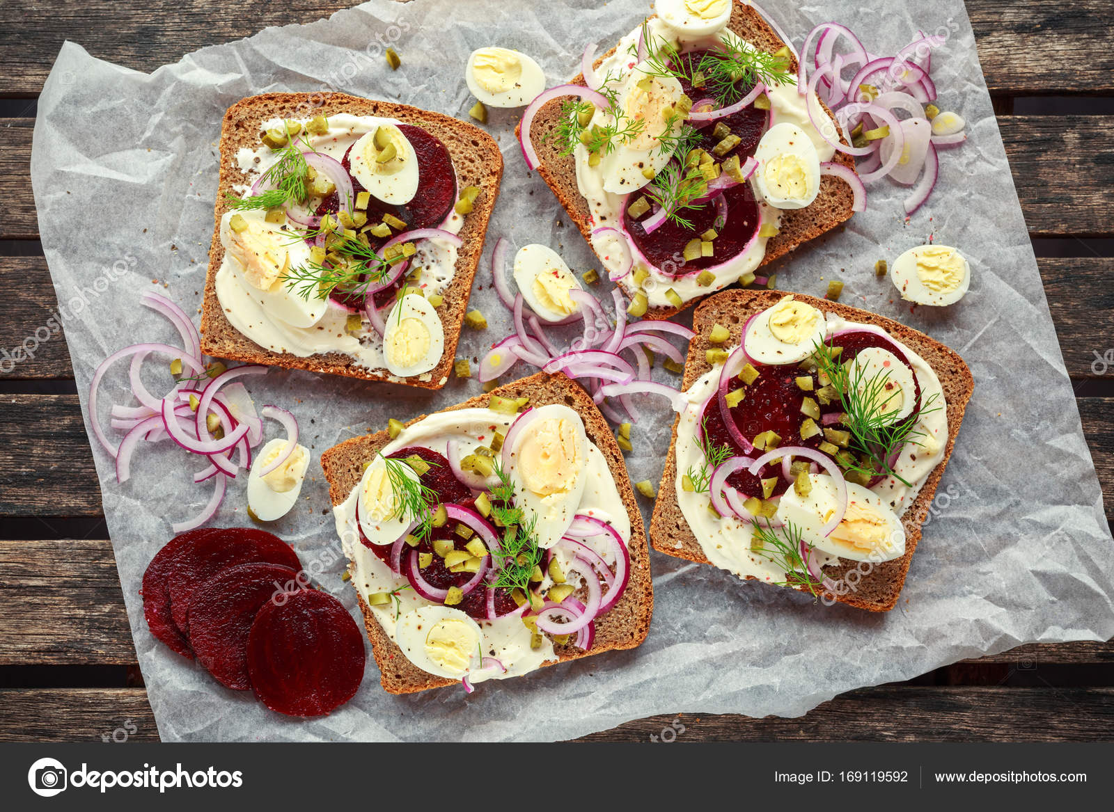 Danish openface rye sandwich with quail eggs, beetroot, pickled onions