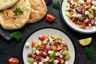 Turkish Shepards Salad with cucumber, tomato, red onion, pepper, parsley pita bread and Feta cheese clipart
