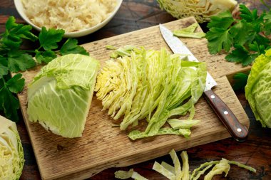 Fresh Slice of Cabbage on wooden chopping board. healthy food