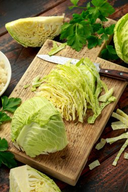 Fresh Slice of Cabbage on wooden chopping board. healthy food
