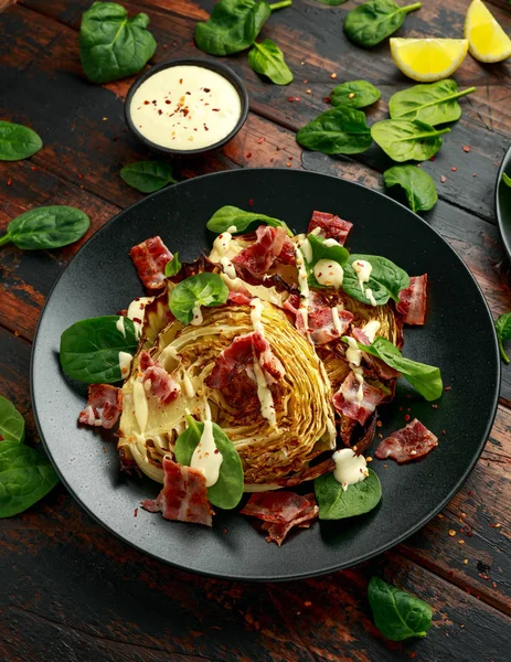 Oven roasted cabbage steaks with bacon, spinach and mayonnaise. healthy food — ストック写真