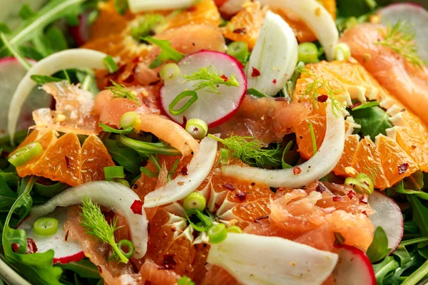 Smoked salmon and fennel salad wild rocket, radishes and sweet clementines — Stock Photo, Image