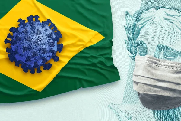 Concept for economic impact of the coronavirus pandemic. Blue virus over brazilian flag besides the Brazilian Real - BRL currency face wearing a mask.