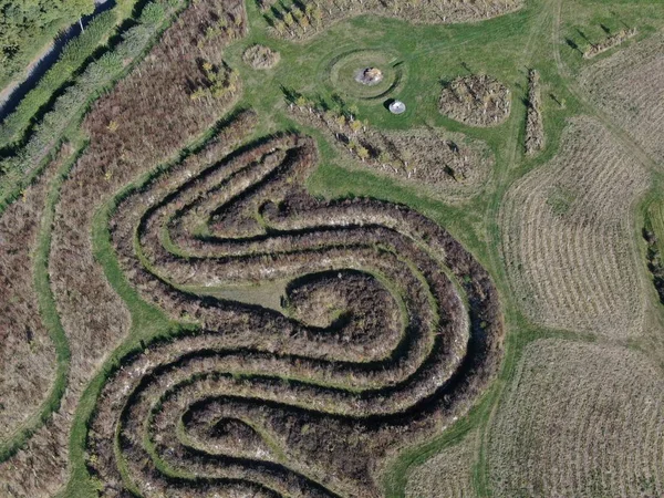 Aerial view of a maze pattern made in a field in the countryside — Stock Photo, Image