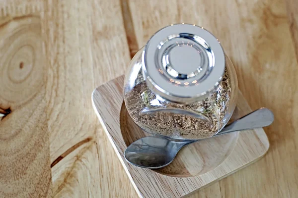 Jar of brown sugar and spoon — Stock Photo, Image