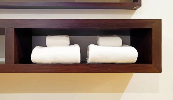 White towels on wooden shelf — Stock Photo, Image