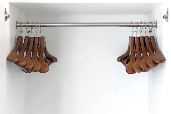 Wooden hangers in wardrobe — Stock Photo, Image