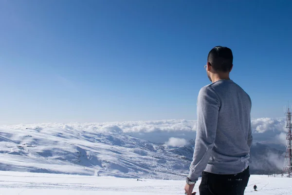 Person in a landscape with snow in Sierra Nevada, Spain