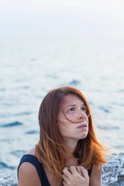 Young woman feeling sad on the pier — Stock Photo, Image