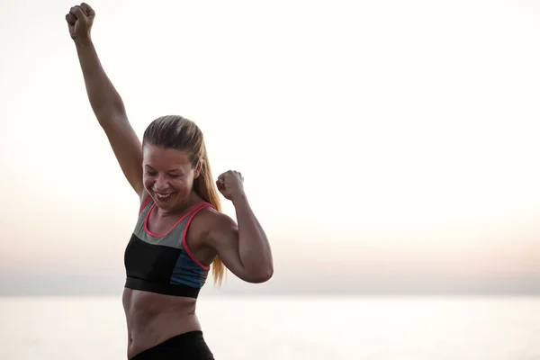 Young Woman Standing Sea Arms Raised Triumph — Stock Photo, Image