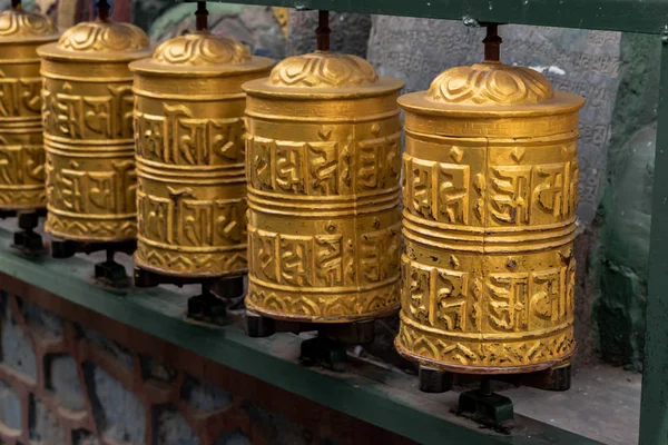 Prayer wheels is spinned by devotees in order to aid for their meditation and accumulating wisdom, good karma and putting negative energy aside