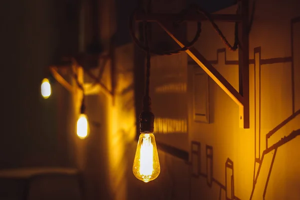 close-up shot of yellow vintage light bulbs on street