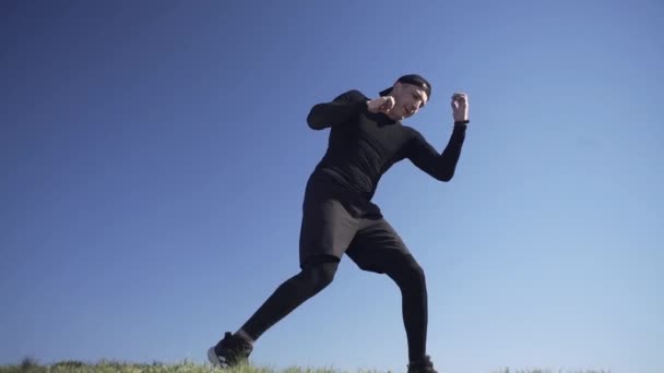 Guy Struggles Shadow Boxing Field Field Guy Island Field — Stock Video