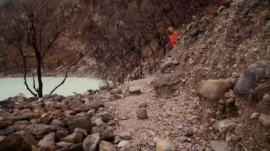 Woman walking near Kawah Putih