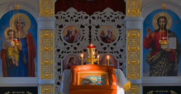 Easter icon of the Resurrection of Christ on the lectern on the background of the iconostasis and the Royal gate in the Orthodox Church in Russia.  Orthodox stock photo
