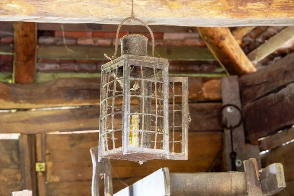 Old wax candle lamp in an old windmill — Stock Photo, Image