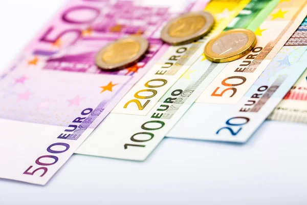 Closeup of banknotes and coins — Stock Photo, Image