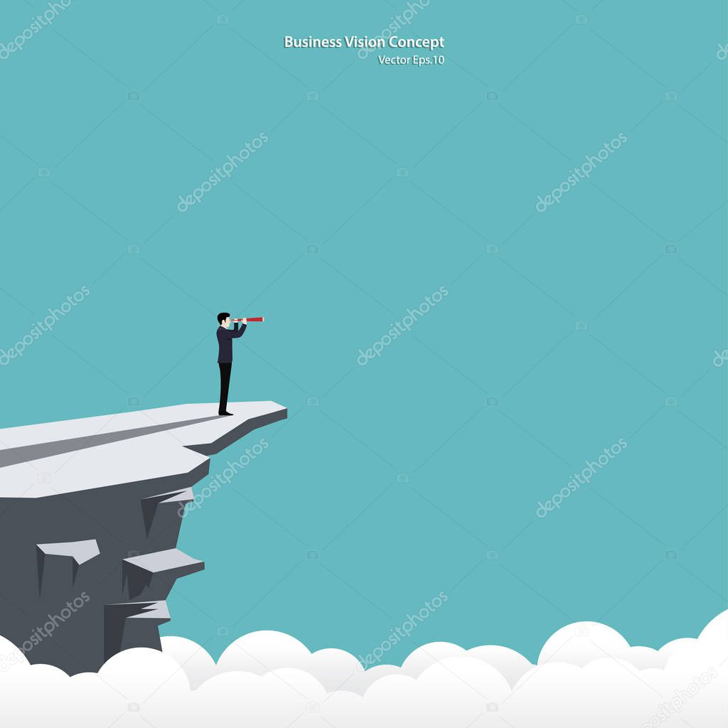 Businessman looking in telescope standing on cliff