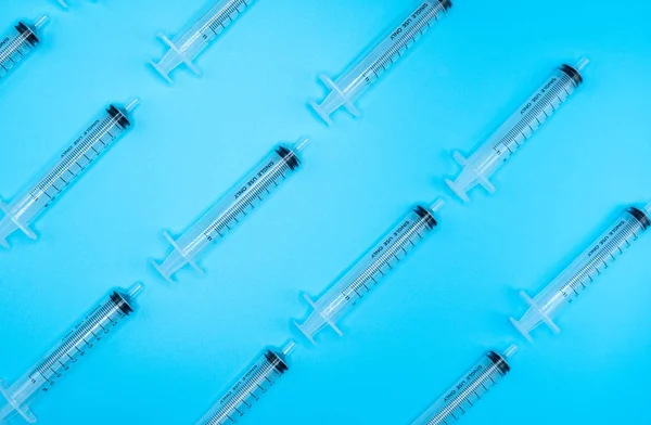 Lot Syringes Mocking Lines Blue Background — Stock Photo, Image
