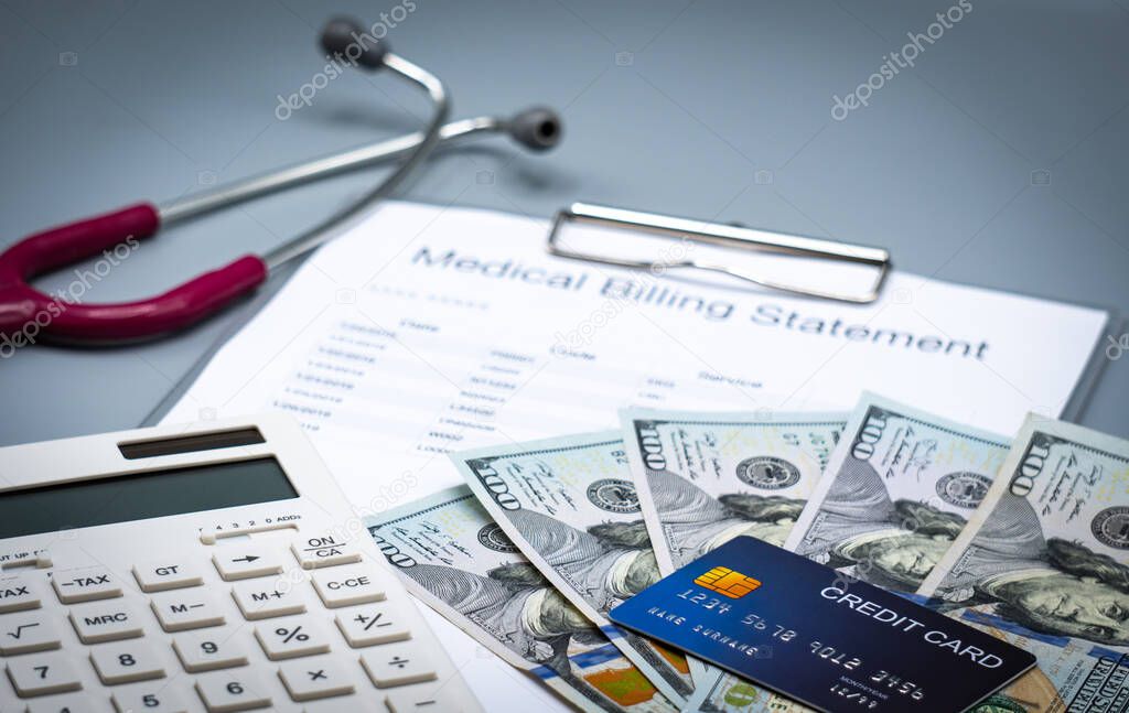 top view picture of medical billing statement, cradit card,  calculator, banknotes and pink stethoscope on the gray background