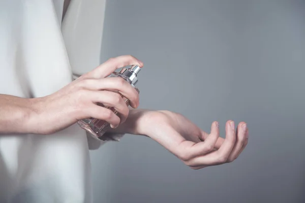 woman hand perfume bottle in hand