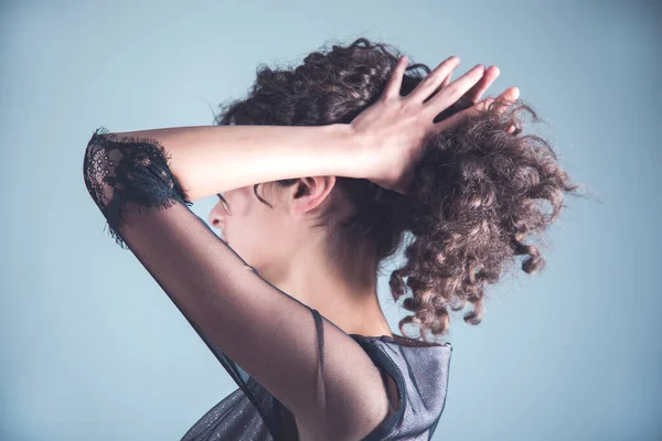 woman tail hair on the dark background