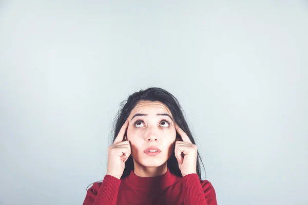 thinking woman hand in head on gray background