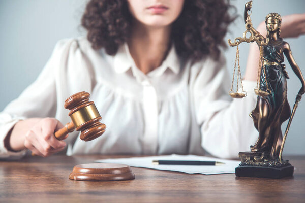 woman hand wooden judge on the desk